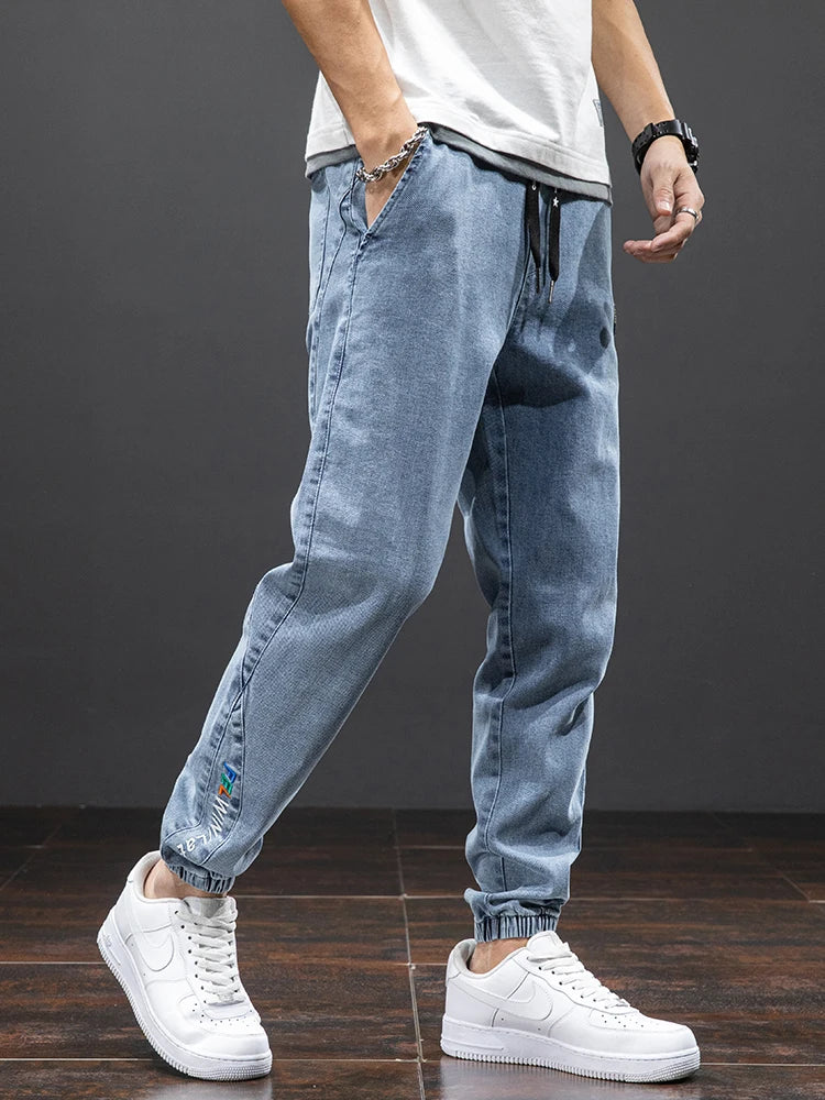 Large size elastic workwear jeans, men's ankle tied Harlan pants, wear-resistant and fat added, plus size trendy and loose
