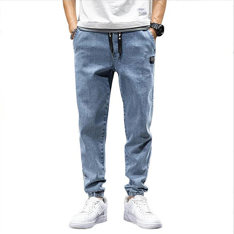Large size elastic workwear jeans, men's ankle tied Harlan pants, wear-resistant and fat added, plus size trendy and loose