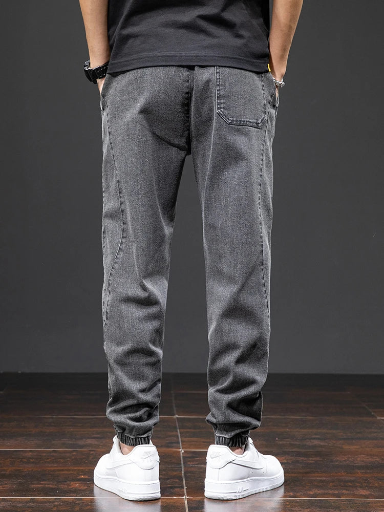 Large size elastic workwear jeans, men's ankle tied Harlan pants, wear-resistant and fat added, plus size trendy and loose