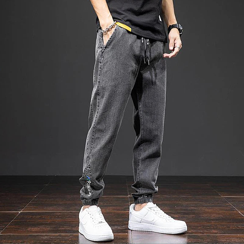 Large size elastic workwear jeans, men's ankle tied Harlan pants, wear-resistant and fat added, plus size trendy and loose