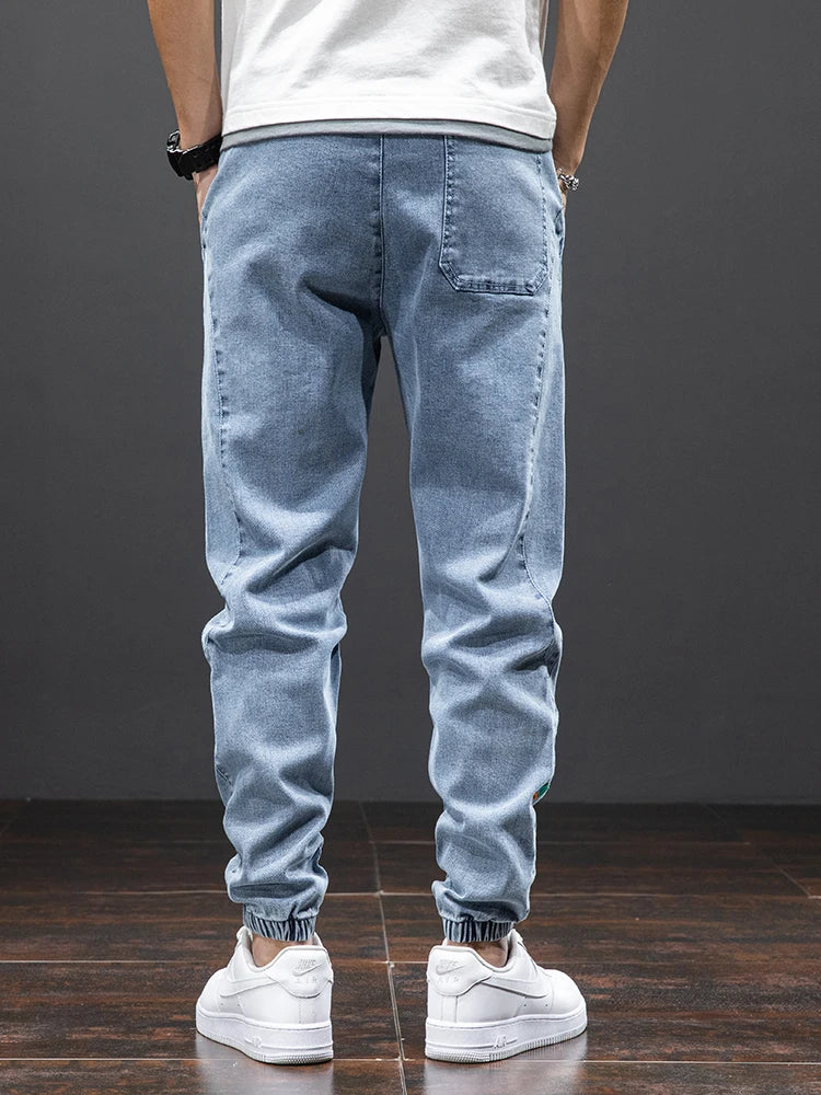 Large size elastic workwear jeans, men's ankle tied Harlan pants, wear-resistant and fat added, plus size trendy and loose