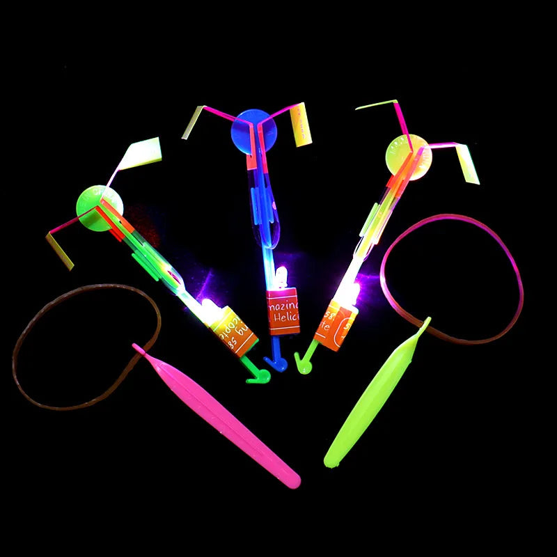 LED Light Toys 50/100pcs Amazing Light Toy Arrow Rocket Helicopter Flying Toy Party Fun Gift Rubber Band Catapult